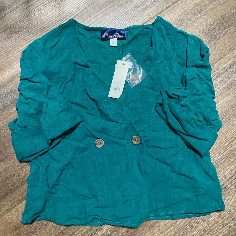 Francesca’s teal blouse